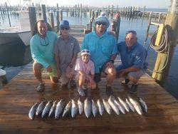 5 people fishing in the waters of Gulf Shores