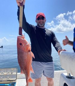 Angler fishing in the scenic Gulf Shores location
