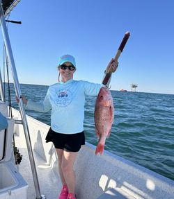 Angler fishing in the waters of Gulf Shores