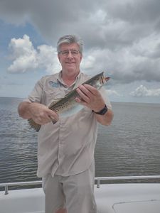 A lone angler fishing in the waters of Gulf Shores
