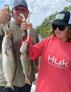 Two spotted weakfish, 22 inches long, caught while fishing in Gulf Shores