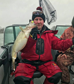 Angler with a 21-inch fish caught in Muskegon