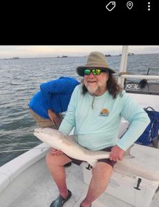 A lone fisherman reeling in a catch in Texas