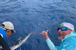 Two people fishing in Corpus Christi with a 19-inch catch