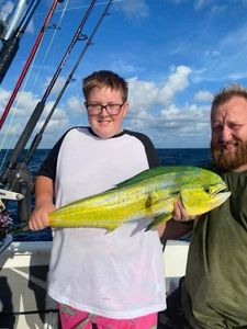Two people fishing on the shore in FL