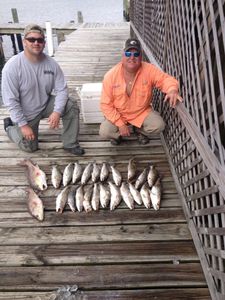 Two anglers with their catch in San Leon