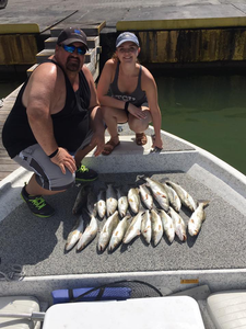 Two people fishing in San Leon