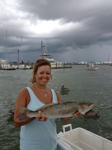 Angler holding a 23-inch fish while fishing in TX