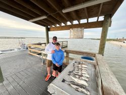 Two people fishing in TX