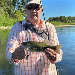 Two people fishing with a single fish in Fort Smith