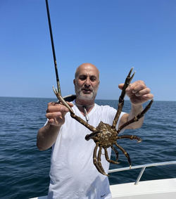 Angler enjoying a cruises, fishing, and tours adventure in Barnstable