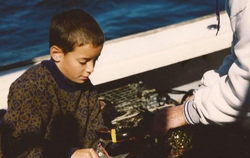 Person enjoying MA cruises, fishing, and tours