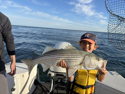 Nice striped bass on a clear day at Barnstable Harbor using multiple techniques.