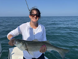 Barnstable Harbor's striped bass challenge: deep sea jigging and trolling under clear skies!