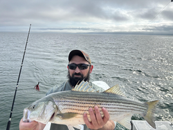 Deep sea jigging for Striped Bass in Barnstable's partly cloudy waters!