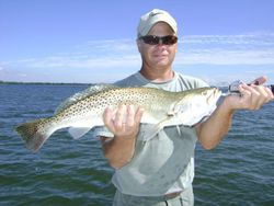 Angler with a spotted weakfish, 24 inches, caught while fishing in Tampa, Florida