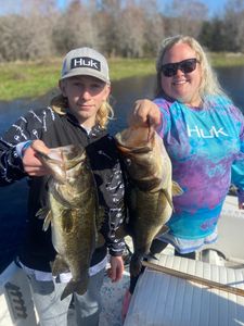 Two people fishing in FL with 2 fish