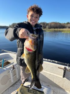 Smiling angler with a large bass