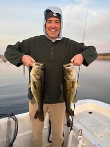 Angler holding two fish in Florida
