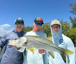 Angler with a large snook fish caught in Jensen Beach