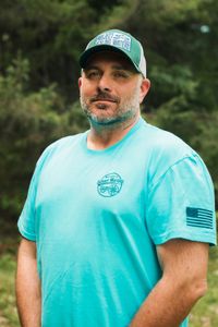Professional fishing guide in South Portland Maine ready for charter tours