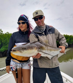 A couple fishing at the beach in New Smyrna Beach