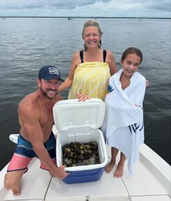Three people enjoying a fishing trip in FL