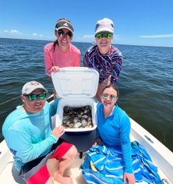 Four friends enjoying a fishing trip in FL