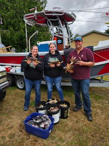 Three people enjoying a fishing trip in Pacific City