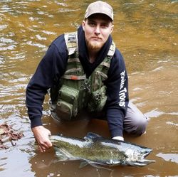 A lone angler fishing in Iron River