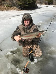Angler with a rainbow trout in Wisconsin