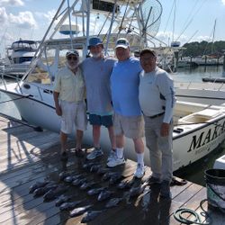 Four anglers in DE enjoying a fishing trip