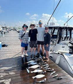 Four people fishing at Rehoboth Beach