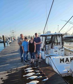 4 friends enjoying a fishing trip in DE