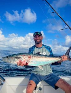 A lone angler reeling in their catch in the picturesque San Juan