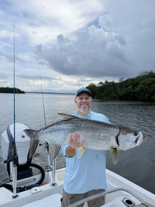 Nice tarpon caught jigging and fly fishing with light tackle under partly cloudy skies!