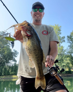 Angler holds a 25-inch fish while fishing in GA