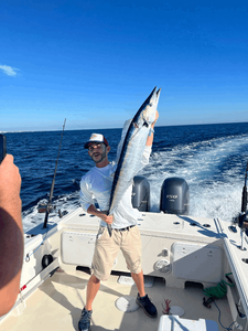 A person fishing in FL with a 33-inch fish