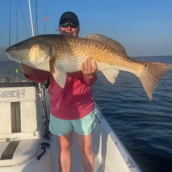 A fisherman reeling in a 40-inch catch in Port Sulphur