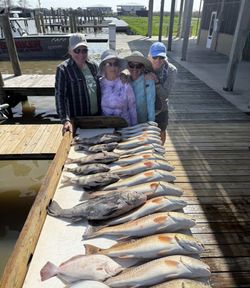 Four people fishing in Port Sulphur