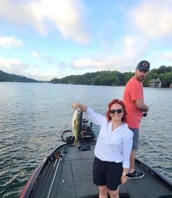 Smokin’ largemouth bass catch on a calm lake morning!