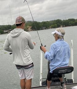 Action-packed moment on the lake—bass on the line!