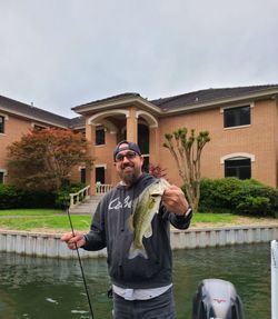 Angler holding large largemouth bass in Austin, Texas