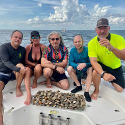 Five people fishing on the water in FL