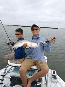 Two people fishing in TX