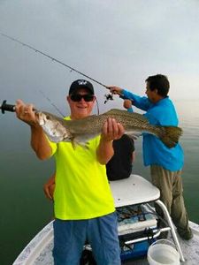 Two people fishing in TX
