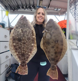Angler holding two large Southern Flounder fish caught in NY
