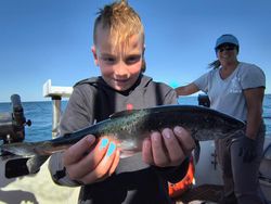 Two people fishing in Wisconsin with a big fish