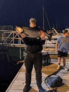 Angler with a large rainbow trout in Milwaukee