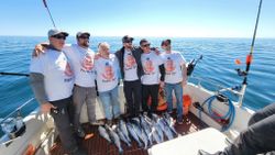 Cheerful group of 11 people enjoying fishing in WI
